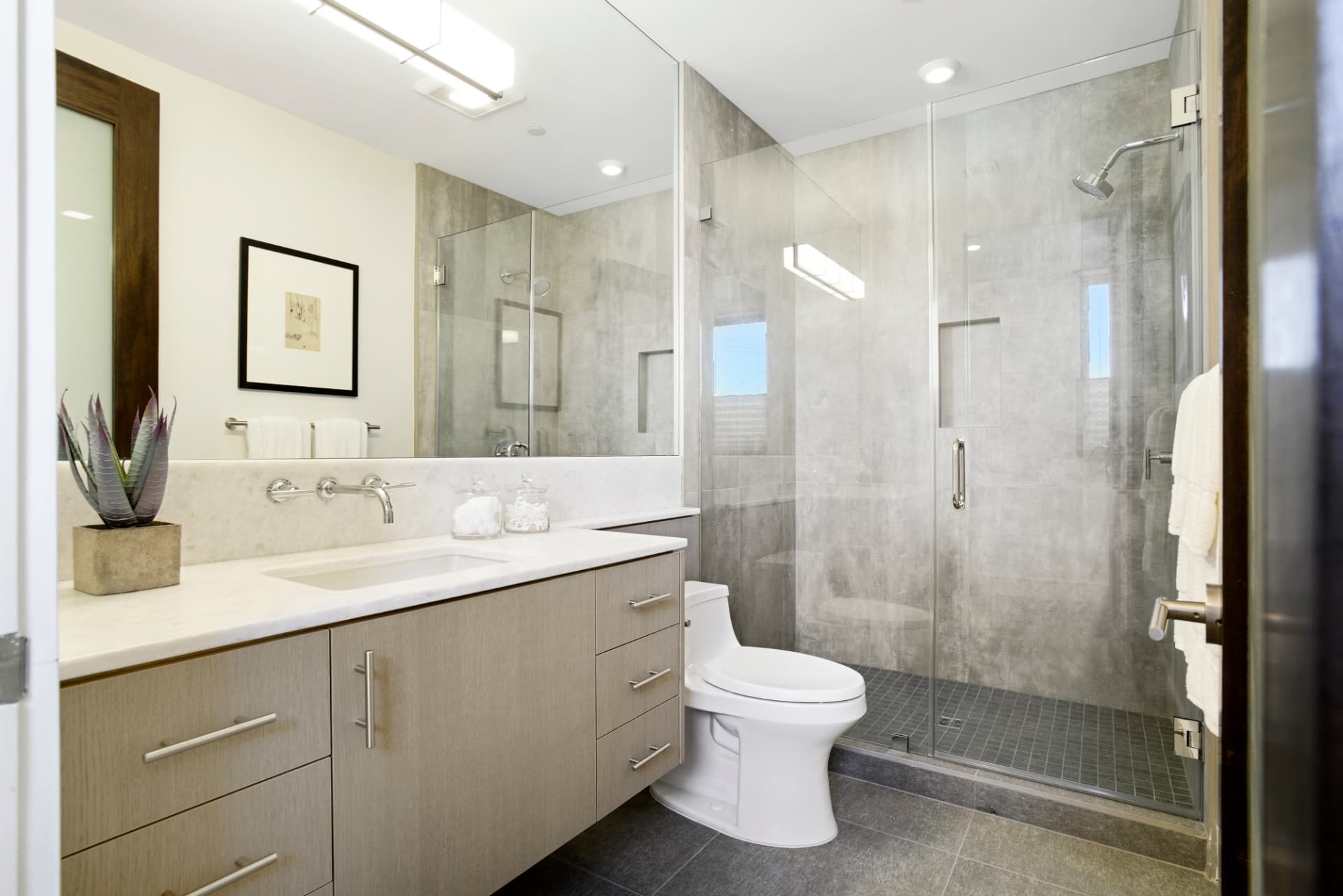 Los Angeles glass-enclosed shower with marble tile