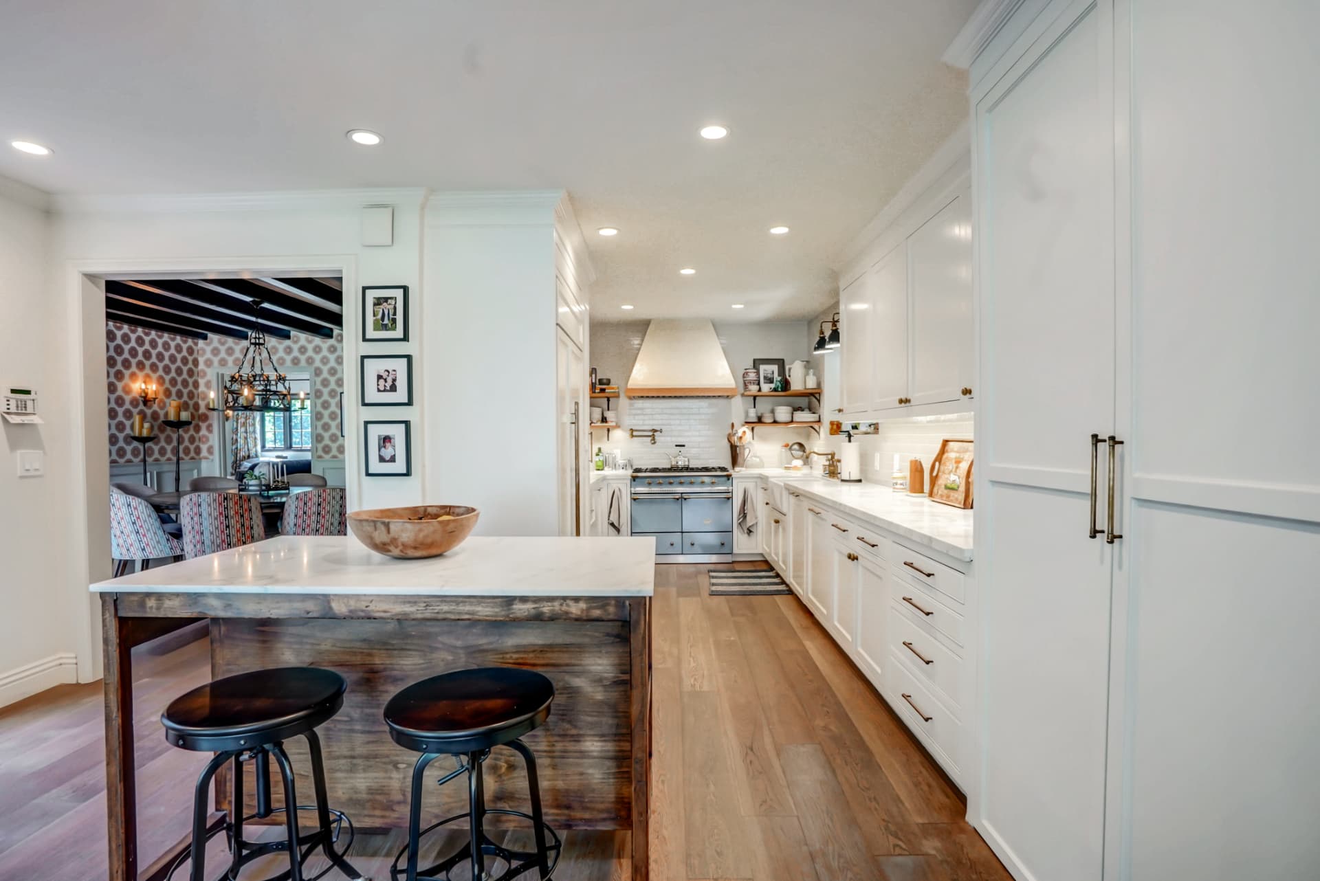 Hancock Park white kitchen with marble island and brass hardware
