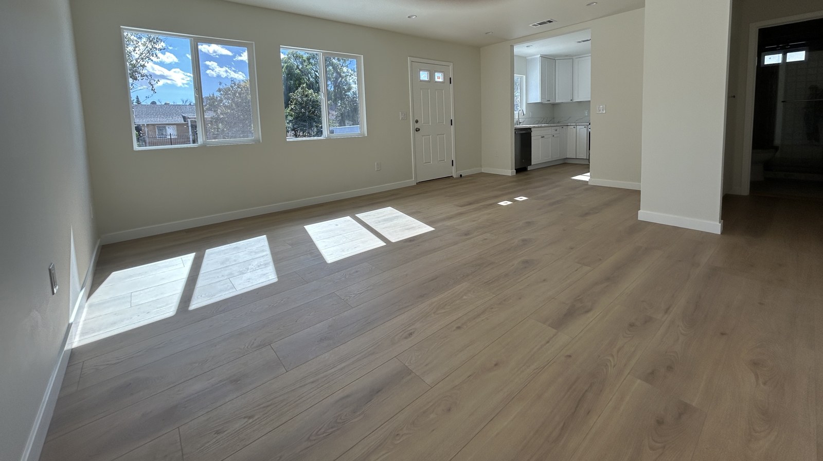 Bright completed interior of an SB9 unit with an open living area and kitchen
