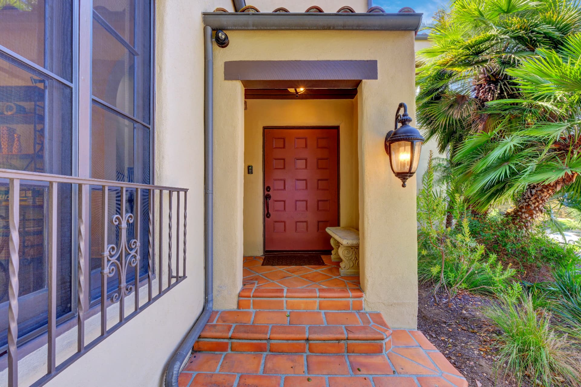 Hancock Park front entry with red door and terracotta tile steps