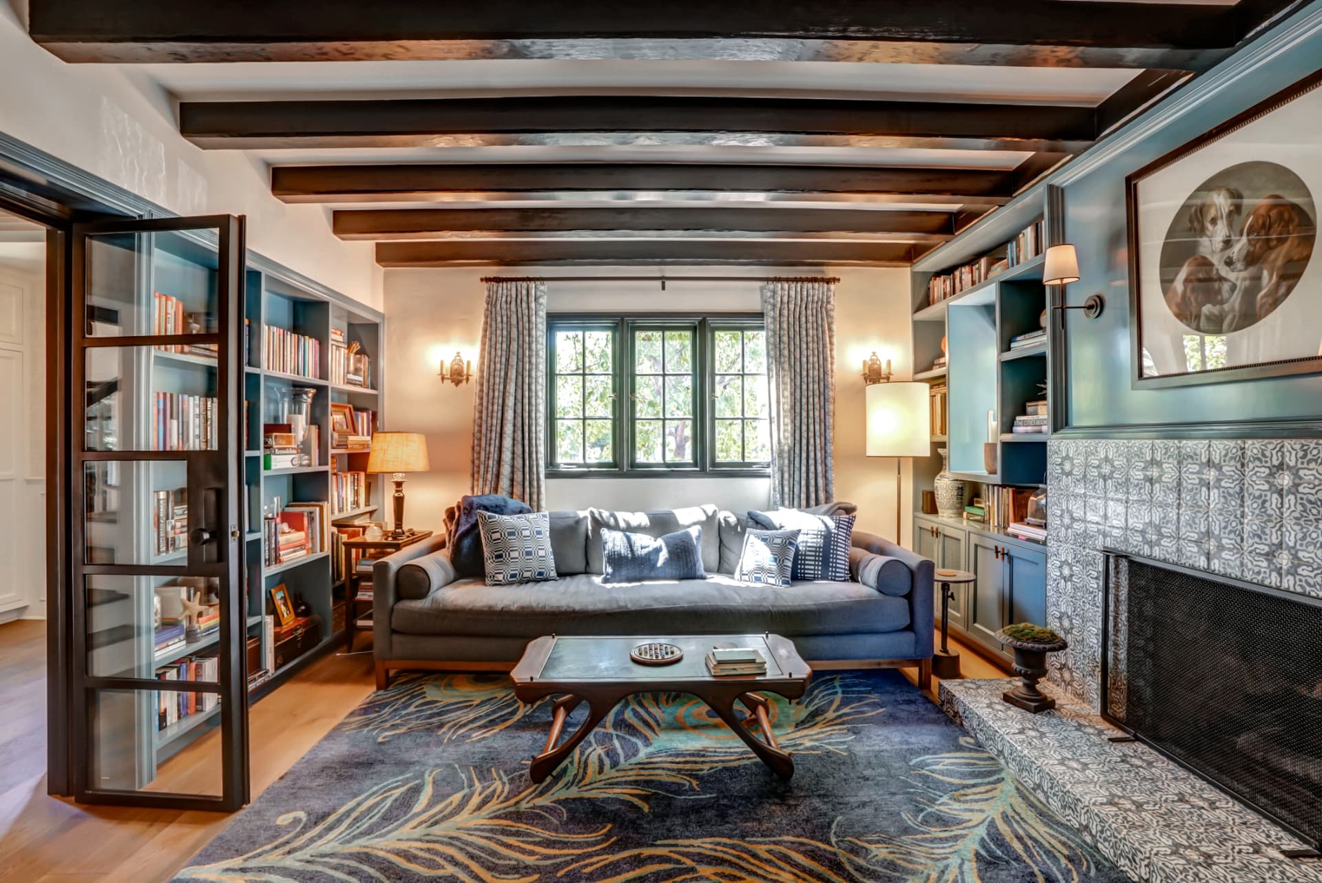 Hancock Park library with built-in bookcases and exposed ceiling beams