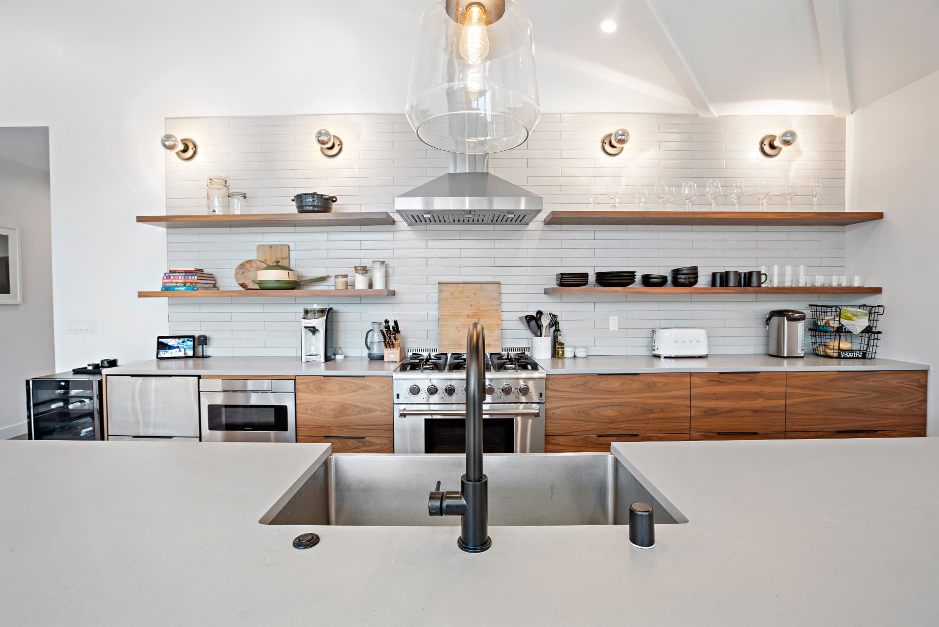 Woodland Hills kitchen with floating shelves and stainless range