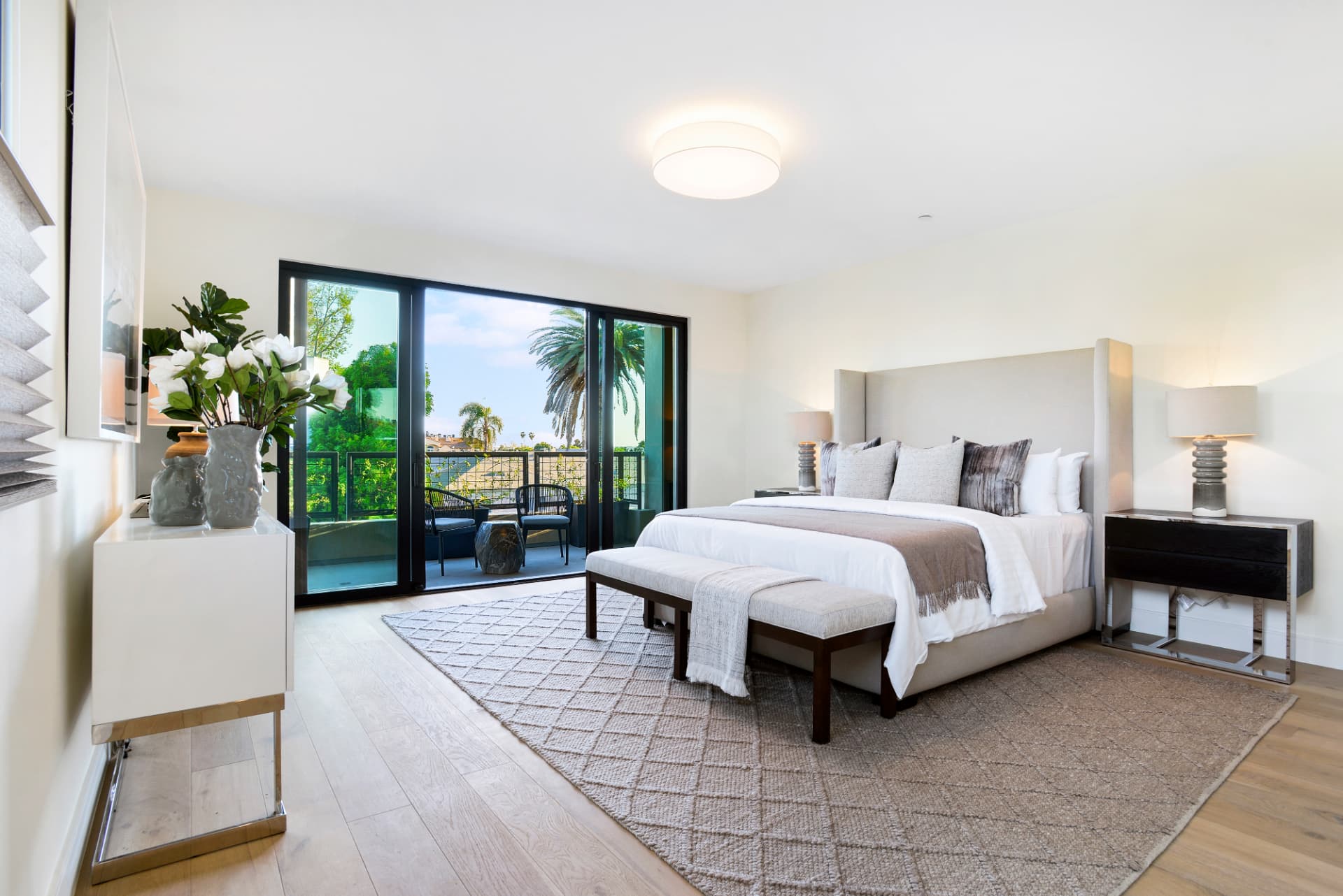Los Angeles primary bedroom with sliding glass doors to balcony