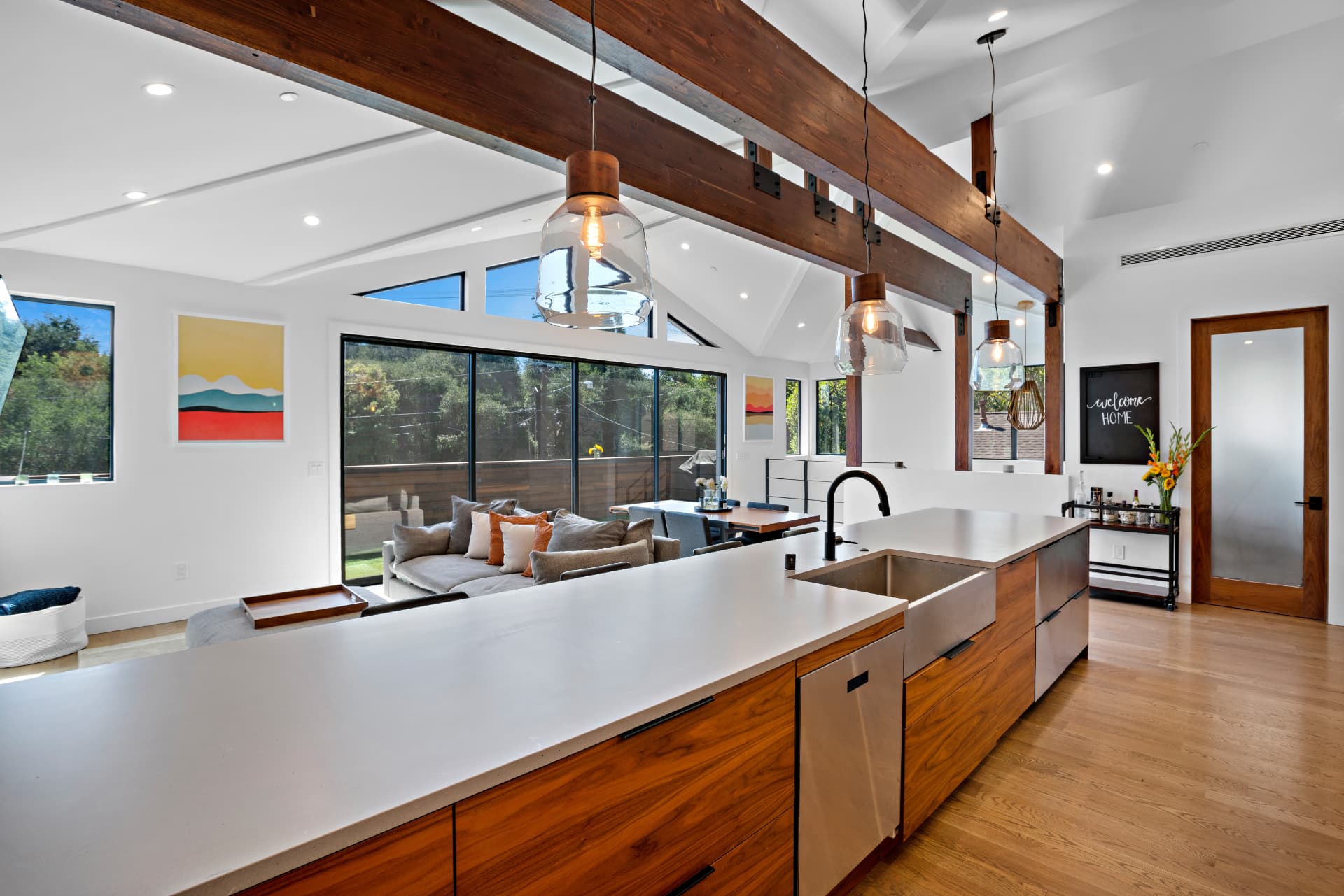 Woodland Hills open kitchen and living area with exposed wood beams