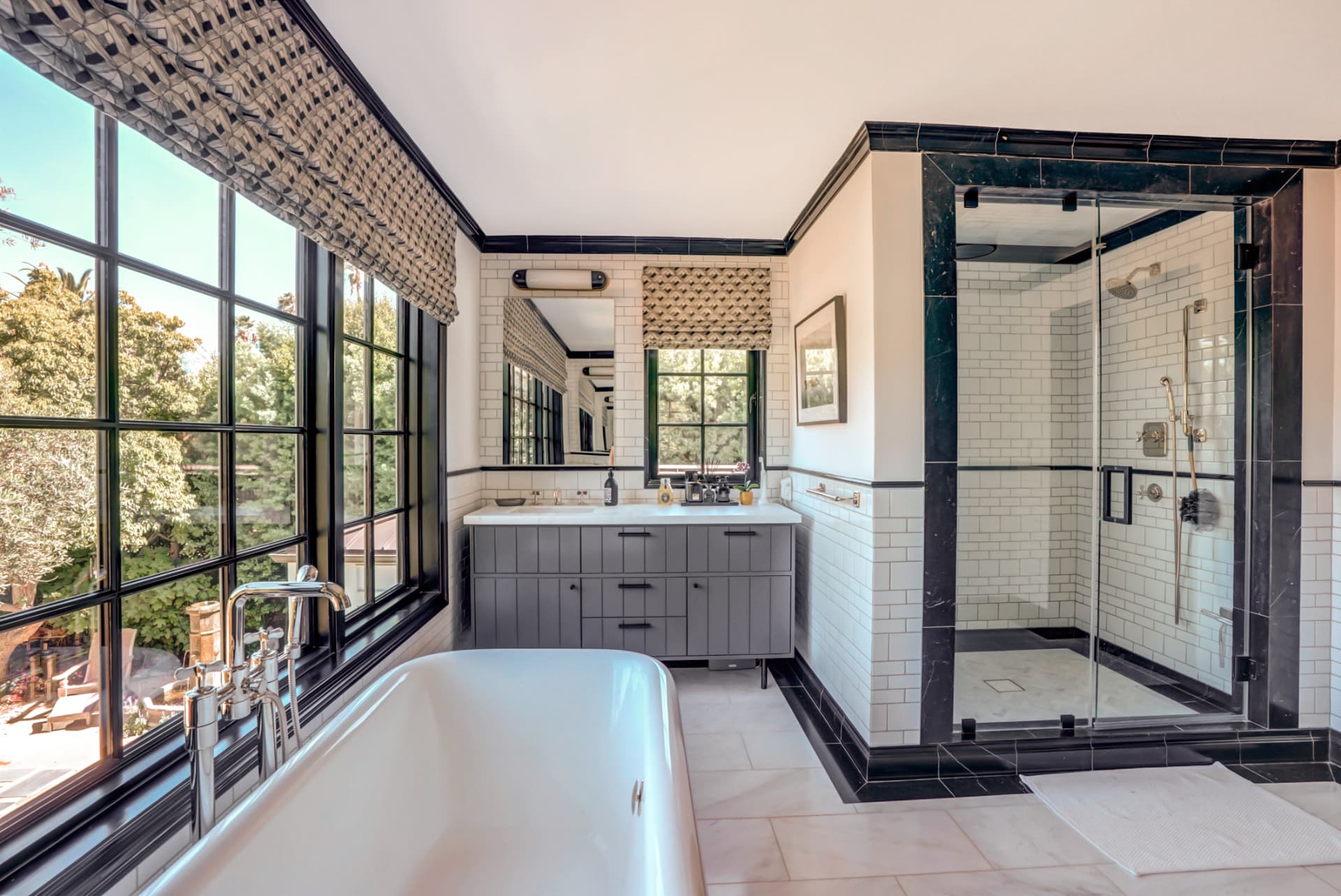 Hancock Park primary bath with freestanding tub and black marble shower